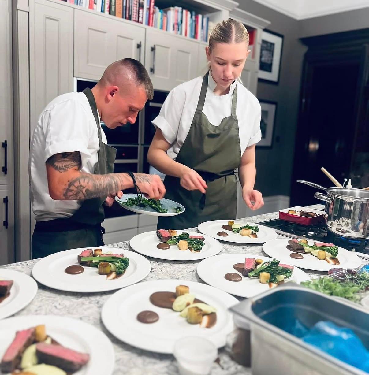 Chef Dale plating a dish with precision